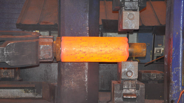 Forged hollow being drawn out on a pin 